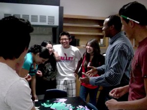Students and ACE educator laughing during Biggest Loser : Energy recap