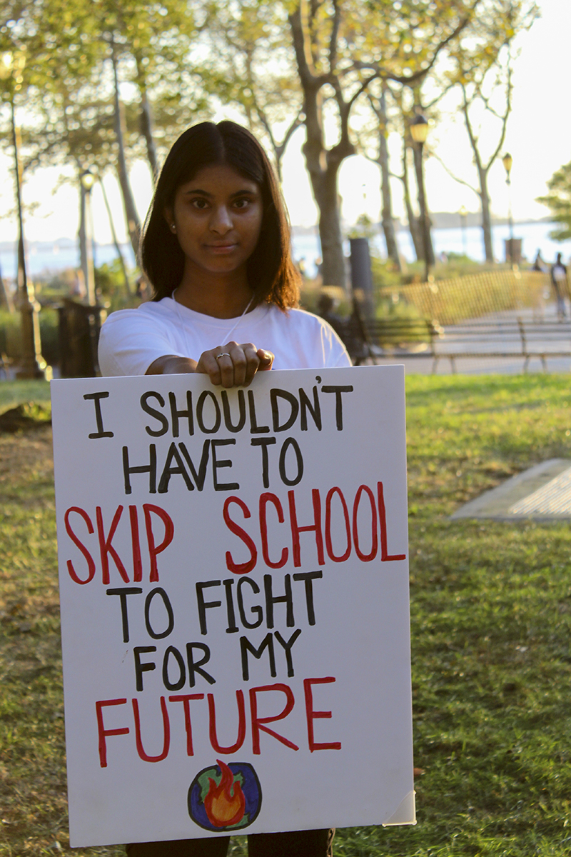 Ananya Seelam holding a sign
