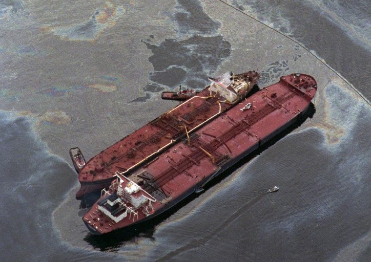 The Exxon Baton Rouge (smaller ship on left) attempts to offload crude oil from the Exxon Valdez after the Valdez ran aground in Prince William sound near Valdez, Alaska, on March 26, 1989.